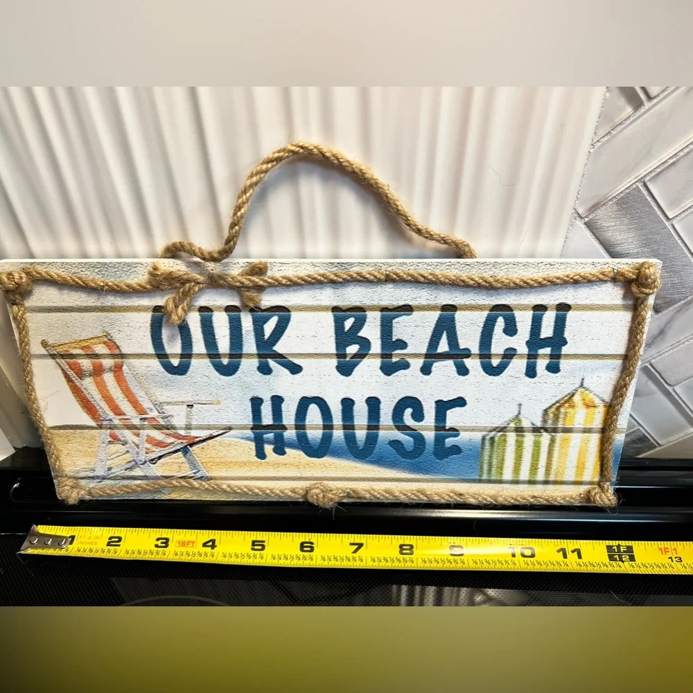 Wooden Beach House with rope sign